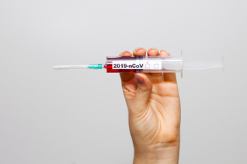Hand holding test tube with patient blood for 2019-nCoV biochemical analysis. Chinese Wuhan virus outbreak. Coronavirus blood test concept