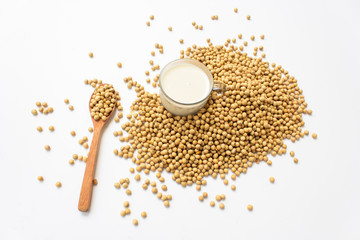 Top view of mung bean milk on a spoon on a white background