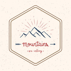 Mountains are calling hand lettering with abstract watercolor splatters