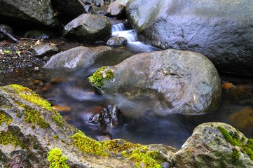Mountain waterfall covered in fog