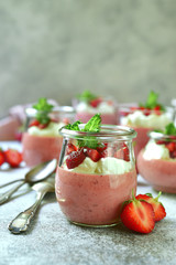 Delicious strawberry mousse with fresh berries and whiped cream.