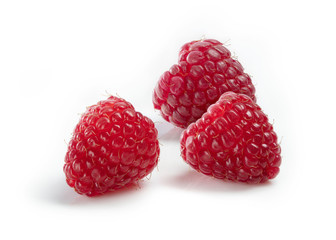 Red raspberries on white background. 