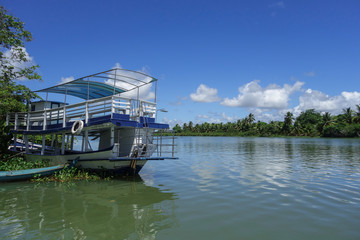 Fototapeta premium Alagoas/Brazil: wooden boats parked on the edge of a tropical river