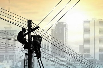 Collage of silhouette 2 technicians on wooden ladder working to install telephone wires on electric...