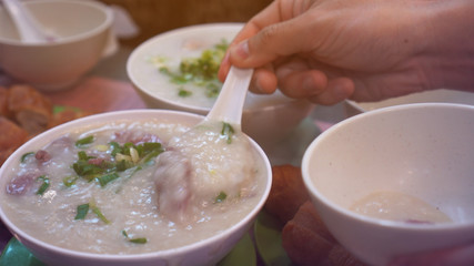 Cantonese congee boiled rice pork soup morning hot meal