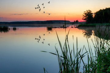 Fototapeta na wymiar Colorful sunrise over the lake ..