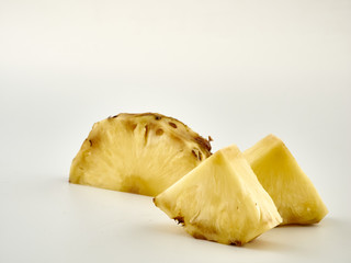 Delicious ripe Pineapple and its slices on a white background.Isolate