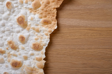 Lavash texture. Tradition bread  lavash on wooden background,  macro.