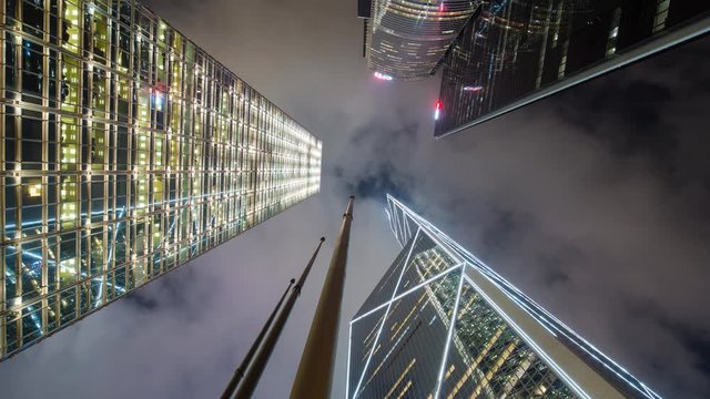 Low angle view of skyscrappers in Central, Hong Kong Island, Hong Kong, China - time lapse