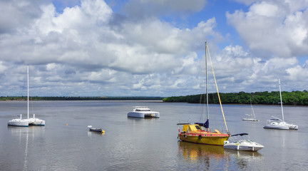 Aracaju/Brazil: sailboats and ships parked at the river bay