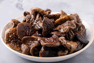 White mushrooms on a plate.