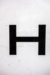 Written Wording in Distressed State Typography Found Letter H