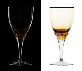 Wine glass with a twisted leg presented in two versions isolated on black and white background