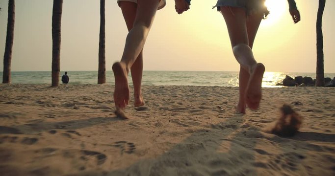 Women friends running enjoy life playing and freedom beach at sunset, Attractive together of asian female traveler with friends people lifestyle. 