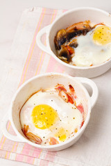 fried eggs with mushrooms and tomatoes, bacon