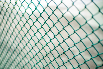 Close-up chain link fence , Sunset background
