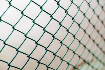 Close-up chain link fence , Sunset background