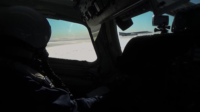 Two planes flying side by side