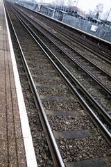 Abstract View of a Train Station and Railway Tracks Mind The Gap