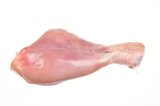 top view of raw chicken leg piece isolated on white background