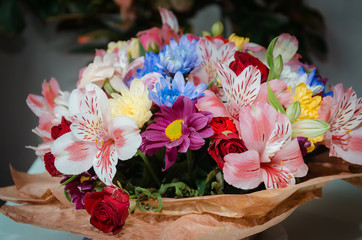 bright flower arrangement on a windowsill against the sky,