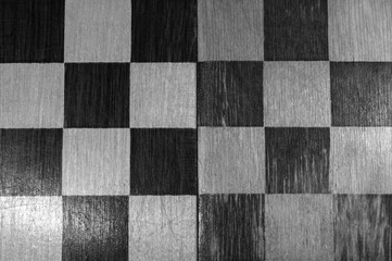 Black and white texture with a chess background, top view