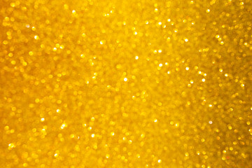 Yellow gold shiny glitter abstract texture background.