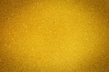 Yellow gold shiny glitter abstract texture background.