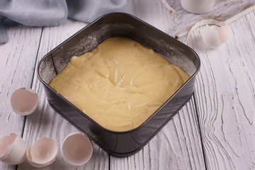 Baking dish with biscuit dough inside