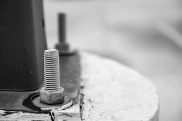 Black and white anchor bolts for structural steel connection to concrete footing