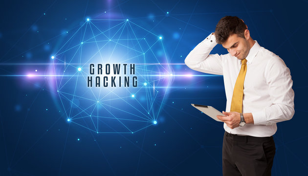 Businessman thinking about security solutions with GROWTH HACKING inscription