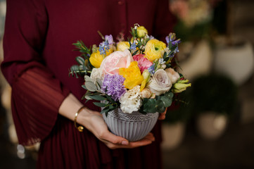 Close shot of small bouquet in textured pot