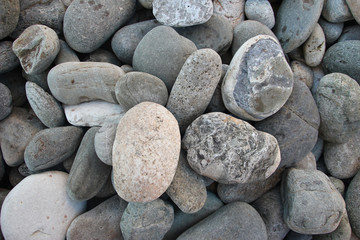Fototapeta na wymiar Large pebbles under the water surface photo background summer sea