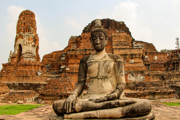 Fototapeta premium Statues of Buddhist monks in the ancient city of Ayutthaya, Thailand.