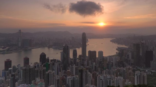 Sunrise over the city skyline and Victoria Harbour viewed from Victoria Peak, Hong Kong, China