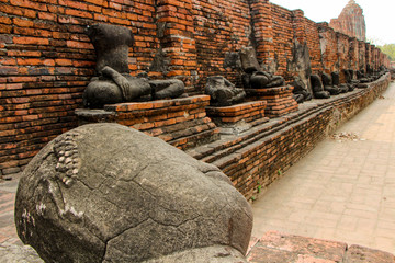 Fototapeta na wymiar Statues of Buddhist monks in the ancient city of Ayutthaya, Thailand.