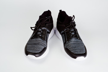 Men's sports shoes dark-colored sneakers with white soles designed for sports and everyday use