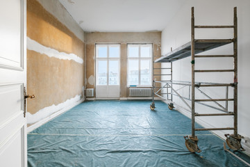 room during renovation with scaffolding - renovate home   concept