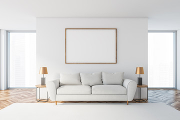 White living room with white sofa and poster