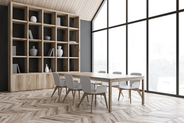 Gray attic dining room corner with bookcase