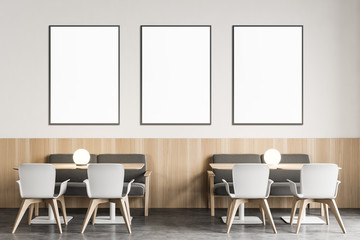 White restaurant with sofas and poster gallery