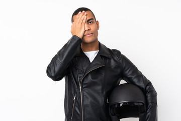 Young handsome man with a motorcycle helmet over isolated white background covering a eye by hand