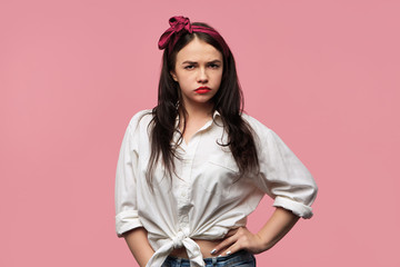 Negative reaction, life perception and feelings. Studio shot of moody young brunette female in...
