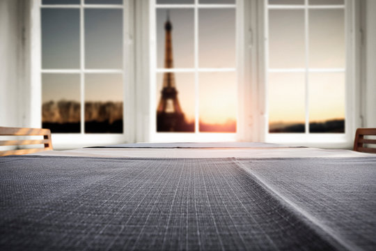 Wooden table of free space for your decoration.Romantic time of Valentine's Day.White wooden window sill with city ladnscape of Paris.Copy space for your product. 