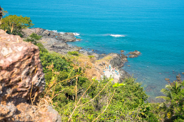 Indian ocean. Panorama of Arabian sea coast, India, Goa. View from the hight of Portuguese-built "Cabo de Rama" Fort. Amazing sand beach, colorful mountains, palm forest. Beautiful aerial view. 