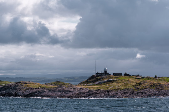 Harsh sea at Mortavika and the weather or radar station on the small hill, Norway