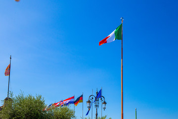 Italian Flag with flags of European Union on the Background