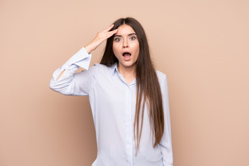 Young woman over isolated background has just realized something and has intending the solution