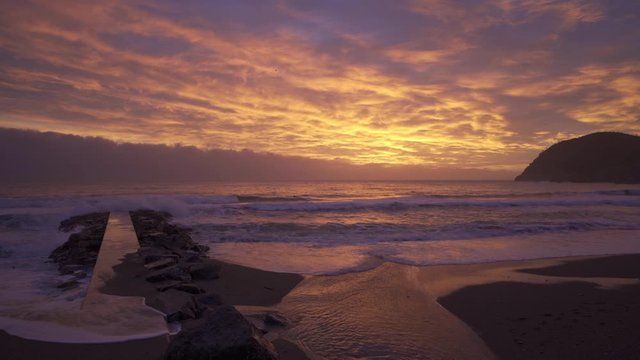 Levanto beach at sunset, pier on the left, beautiful, liguria, italy, famous place for surfers