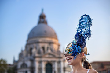 Celebration of Venice Carnival with Venetian mask at the canals of Venice, Italy. Vacation concept...